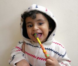kid with tooth brush